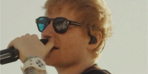 Ed Sheeran was seen wearing black Prada PR A16S 16K04D sunglasses with green-blue Polarised lenses in his Instagram reel, April 2025 promoting new music "Azizam".