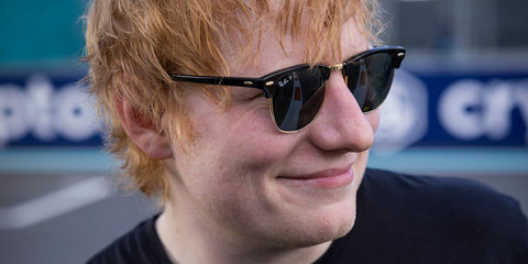 Ed Sheeran was seen wearing the iconic Ray-Ban Clubmaster RB 3016 901/58 sunglasses with Polarised lenses in black at the F1 Miami Grand Prix 2024.