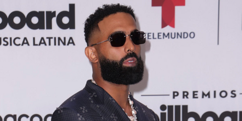 Puerto Rican rapper and singer Eladio Carrion was seen wearing silver Cartier C Decor CT0330S 004 sunglasses with grey lenses at the Premios Billboard de la Musica Latina 2023. Shop online now on Pretavoir