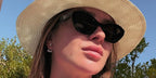 Ukrainian professional tennis player Elina Svitolina was seen wearing black Prada PR A02S 16K08Z sunglasses in Muscat, shared through her Instagram post in November 2024.