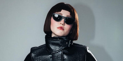 Actress Ella Aiko Anderson was seen wearing black Ray-Ban RB 4453 601S/71 sunglasses in a Numero Netherlands feature, December 2025.