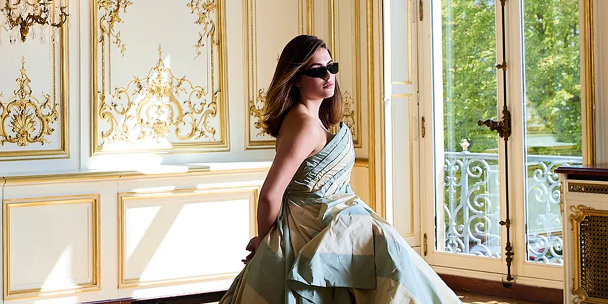 Off Campus actress Ella Bright was seen wearing black Saint Laurent Sun SL 963 001 wraparound sunglasses in a Tatler feature, July 2026.