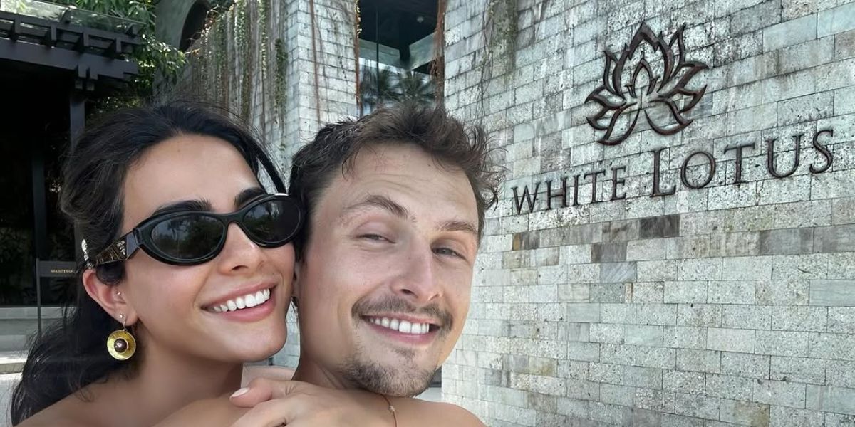 Emeraude Toubia was seen wearing black Prada PR 26ZS 16K08Z cat eye sunglasses on the set of The White Lotus season 3 in Thailand, with boyfriend Arnas Fedaravicius