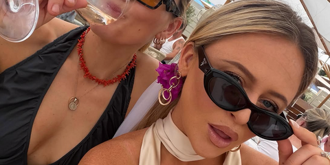 Actress Emily Atack was seen wearing black Prada PR 26ZS 16K08Z cat eye sunglasses in Cannes for her bachelorette trip, shared through Instagram in June 2026.