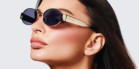Emily Ratajkowski was seen wearing gold Marc Jacobs Marc 806/S RHLIR oval sunglasses in the Marc Jacobs Eyewear Spring/Summer 2025 campaign.
