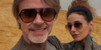 Canadian actress Emmanuelle Chriqui, pictured with partner Sam Trammell, was seen wearing gold Ray-Ban Aviator 3025 001/51 Gold/Light Brown Gradient sunglasses in her Instagram post
