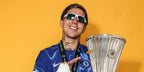 Argentine footballer Enzo Fernandez of Chelsea FC was seen wearing white Oakley Flak 2.0 XL OO9188 94 sunglasses for a photograph with the UEFA Conference League trophy during the Winners' Shoot after the team's victory in the UEFA Conference League Final 2025.