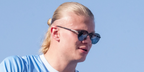 Norwegian footballer Erling Haaland of Manchester City was seen wearing black Prada PR B51S 1AB5Z1 Polarised round sunglasses during the open-top bus parade in May 2025.
