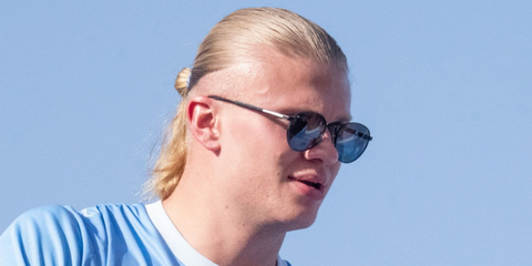 Norwegian footballer Erling Haaland of Manchester City was seen wearing black Prada PR B51S 1AB5Z1 Polarised round sunglasses during the open-top bus parade in May 2025.