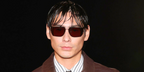 Evan Mock wore silver Saint Laurent SL 750 003 sunglasses with brown lenses at the Saint Laurent Spring Summer 2027 show during Paris Fashion Week.
