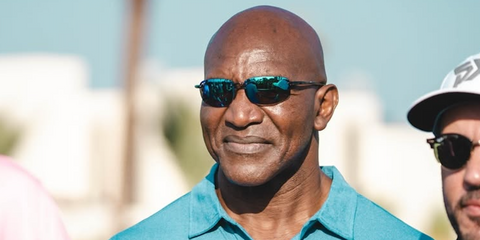Evander Holyfield was seen wearing black Maui Jim Ho'okipa B407-11 sunglasses with blue lenses in a golf event in Abu Dhabi, January 2025