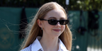 Actress Evie Templeton was seen wearing black Miu Miu MU A06S 16K08Z sunglasses at the Wimbledon Tennis Championships 2026.