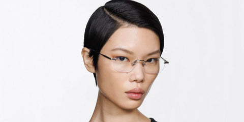 Female model wears Tom Ford TF6117-B 016 Blue Control rimless optical glasses
