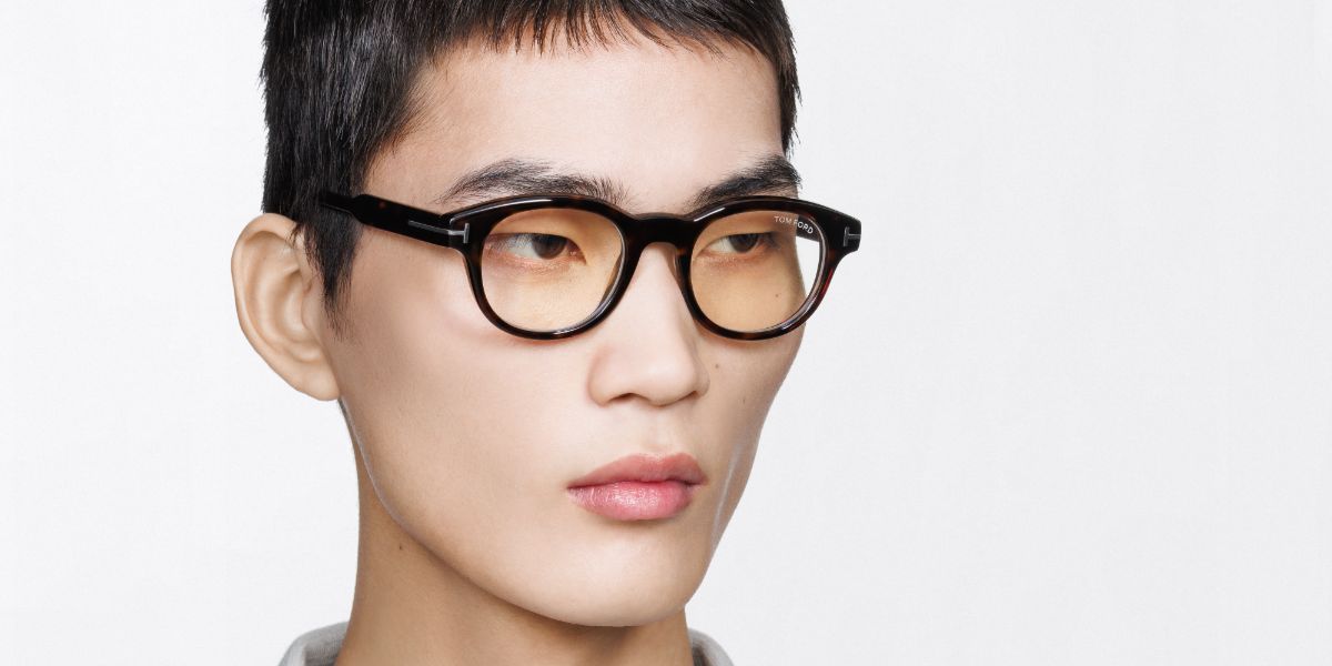 Male model wears Tom Ford TF6121 B 052 Blue Control round havana glasses