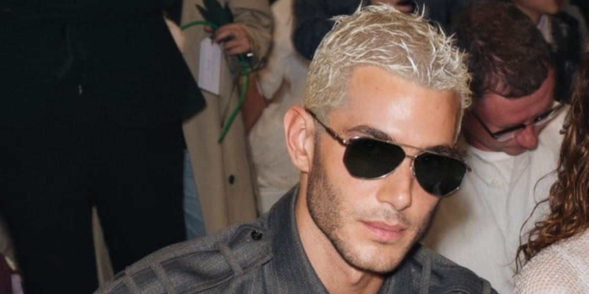 Fai Khadra wore silver Bottega Veneta BV1508S 004 aviator sunglasses with green lenses at the Bottega Veneta Spring Summer 2027 show during Milan Fashion Week.