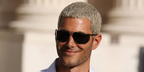 Fai Khadra was seen wearing silver Saint Laurent SL 750 003 glacier-style sunglasses at the Saint Laurent Menswear Spring/Summer 2027 during Paris Men's Fashion Week.