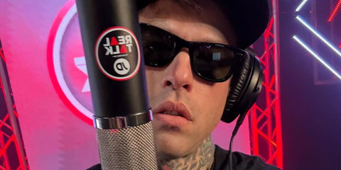 Fedez is seen wearing Ray-Ban Wayfarer 2140 901 Black sunglasses in his Instagram post