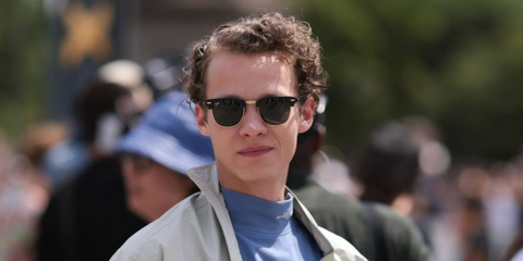 Austrian actor Felix Kammerer was seen wearing the iconic Ray-Ban Clubmaster 3016 W0365 Black half-rim sunglasses at the Dior Menswear Spring/Summer 2024 fashion show during Paris Men's Fashion Week. Shop online now on Pretavoir