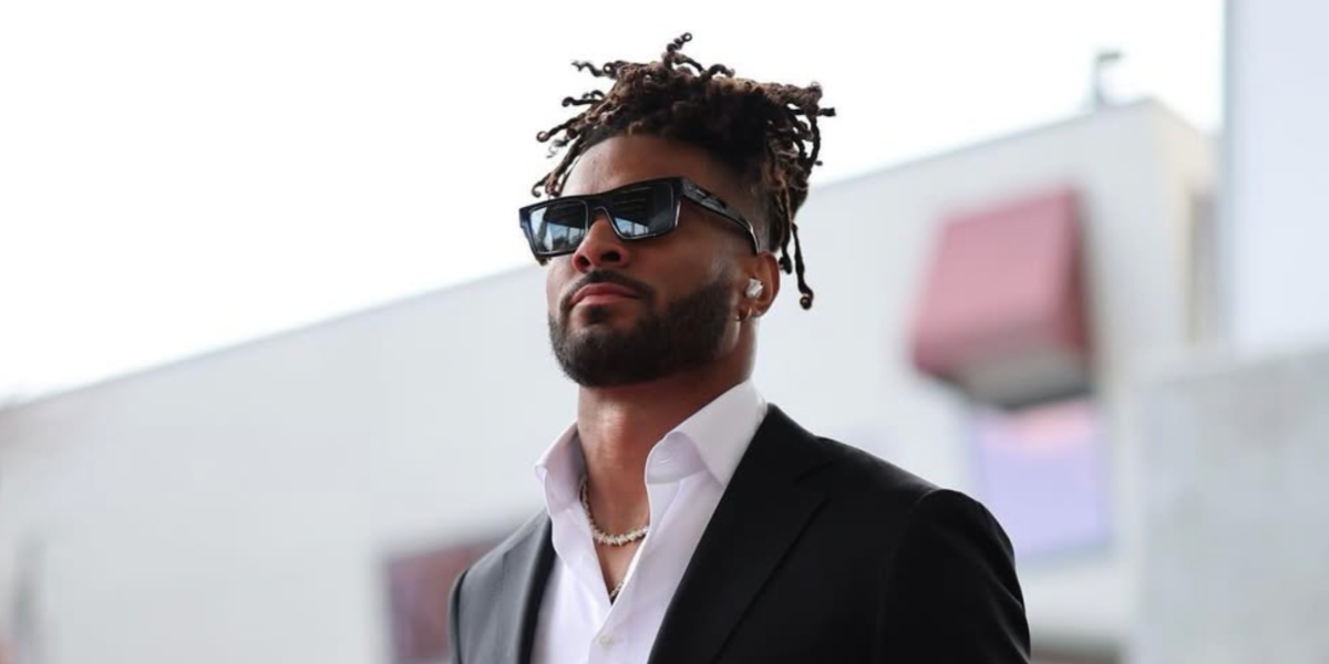 American football athlete Fred Warner was seen wearing black Prada PR 19WS 1AB5S0 sunglasses in his Instagram post