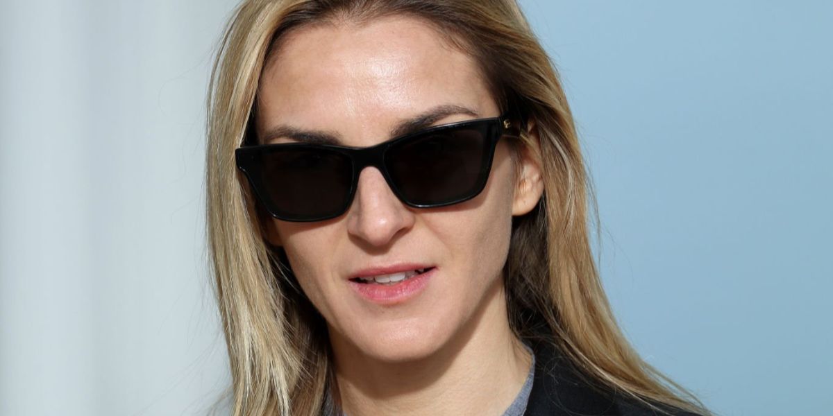 Jewellery designer Gaia Repossi was seen wearing black Bottega Veneta BV1119S 001 cat eye sunglasses at the Miu Miu Fall/Winter 2023 fashion show during Paris Fashion Week.