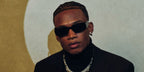Garrett Wilson was seen wearing black Prada PR 17WS 1AB5S0 Symbole Sunglasses after winning Offensive Rookie of the Year during NFL Honor in Phoenix, Aruzona, February 2023