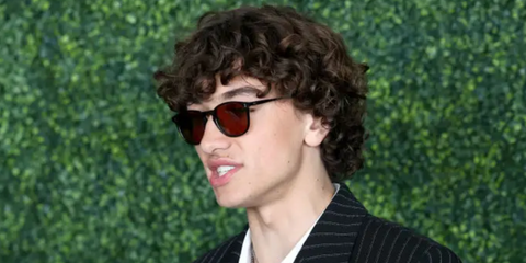 Gavin Casalegno was seen wearing black Oliver Peoples Finley 1993 Sun OV5491SU 1731/53 sunglasses with brown lenses to attend the 2024 Film Independent Spirit Awards