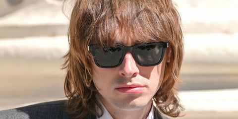 Son of Liam, Gene Gallagher, was seen wearing black Saint Laurent Sun SL 790 001 sunglasses at the Saint Laurent Menswear Spring/Summer 2026 fashion show during Paris Men's Fashion Week. Shop online now on Pretavoir