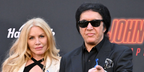 Gene Simmons, pictured with wife Shannon Tweed, was seen wearing black Ray-Ban New Wayfarer 2132 901/58 Polarised sunglasses at the Los Angeles Premiere of Lionsgate's "John Wick: Chapter 4" in March 2023