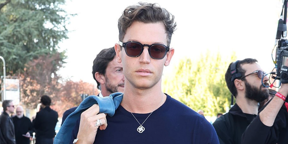 George Tabor-King was seen wearing transparent blue Prada PR A16S 17T05D sunglasses with brown lenses at the Prada Spring/Summer 2027 show during Milan Fashion Week.