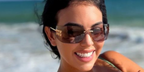Georgina Rodriguez wearing Miu Miu rimless runway sunglasses while on family holiday