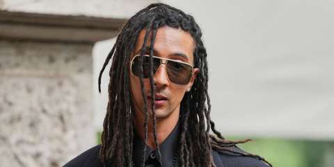 Italian rapper Ghali was seen wearing gold Tom Ford Stavros TF1204 30N sunglasses at the Jil Sander Spring/Summer 2026 fashion show during Milan Fashion Week.