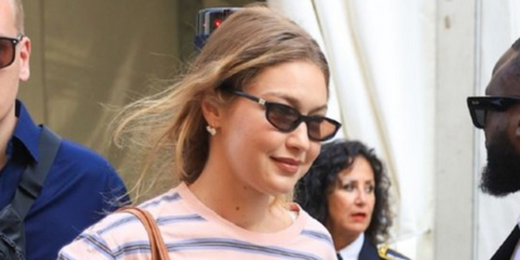 Gigi Hadid was seen wearing black Miu Miu MU A06S 16K10I sunglasses with brown lenses in Milan, ahead of Spring/Summer 2027 fashion week