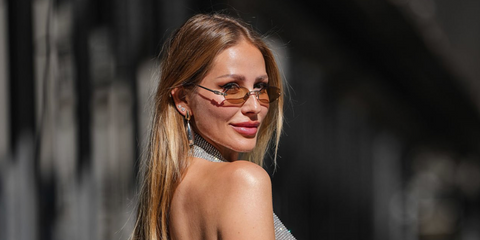 Swiss singer Ginta Biku was seen wearing silver Miu Miu MU A54S 1BC90Q rimless oval sunglasses with brown lenses during Paris Haute Couture Week season Fall/Winter 2025