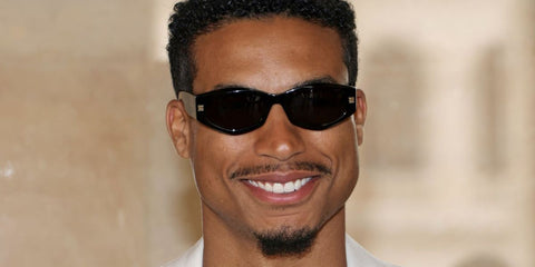 Top Gun: Maverick actor Greg Tarzan Davis was seen wearing black Givenchy GV40062I 01A sunglasses at the Givenchy Menswear Spring/Summer 2024 fashion show during Paris Men's Fashion Week