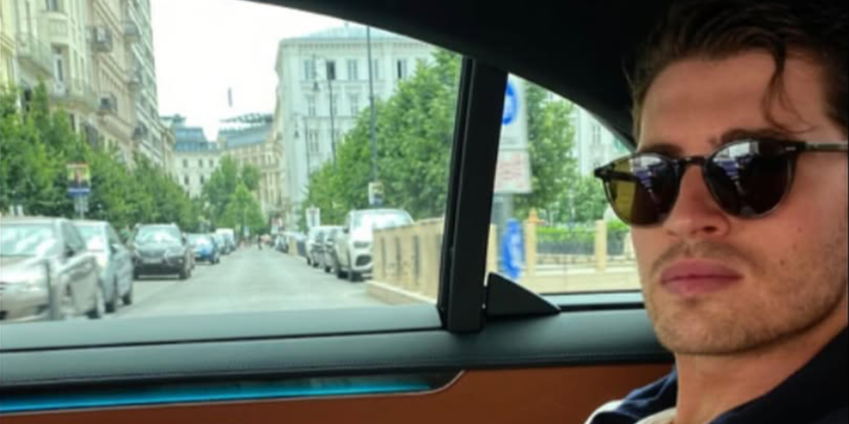 Gregg Sulkin was seen wearing horn brown Oliver Peoples Riley Sun OV5004SU 1666/57 Polarised round sunglasses while filming for Visit Hungary
