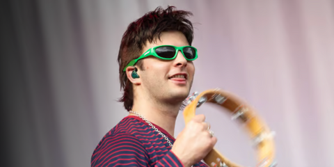 Irish musician Grian Chatten, frontman of Fontaine D.C., was seen wearing green Bottega Veneta BV1184S 003 sunglasses onstage during Day 1 of Hurricane Festival 2024 in Scheessel, Germany. Shop online now on Pretavoir
