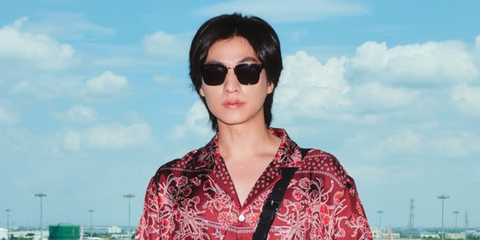Thai actor and celebrity Gulf Kanawut was seen wearing black and gold Gucci GG1226S 001 half-rim sunglasses with brown lenses in his Instagram post, September 2025.