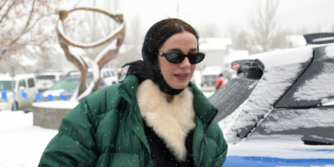 Actress and writer Hailey Gates was seen wearng black Prada PR 26ZS 16K08Z cat eye sunglasses at the Sundance Film Festival 2025.