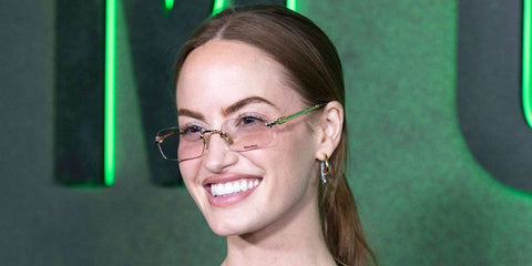 Creator and model Haley Kalil was seen wearing gold Miu Miu MU 50YV 5AK1O1 optical glasses at the New York premiere of Netflix's Monster: The Ed Gein Story in September 2025.