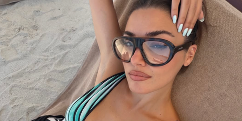 Turkish actress Hande Ercel was seen wearing tortoise Prada PR C05S 20D08N sunglasses with clear lenses in her Instagram post, July 2026.