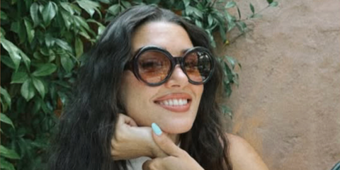 Turkish actress Hande Ercel was seen wearing black Prada PR D08SU 16K10X round sunglasses with brown gradient lenses in her Instagram post, July 2026