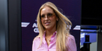 Hannah St John, girlfriend of New Zealand racer Liam Lawson was seen wearing gold Miu Miu MU A51S 5AK20P rimless sunglasses with brown lenses at the F1 Grand Prix of Australia, March 2026.