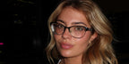Basketball player Hannah White was seen wearing black Versace 1233Q 1366 cat eye optical glasses in her Thread post, October 2024.