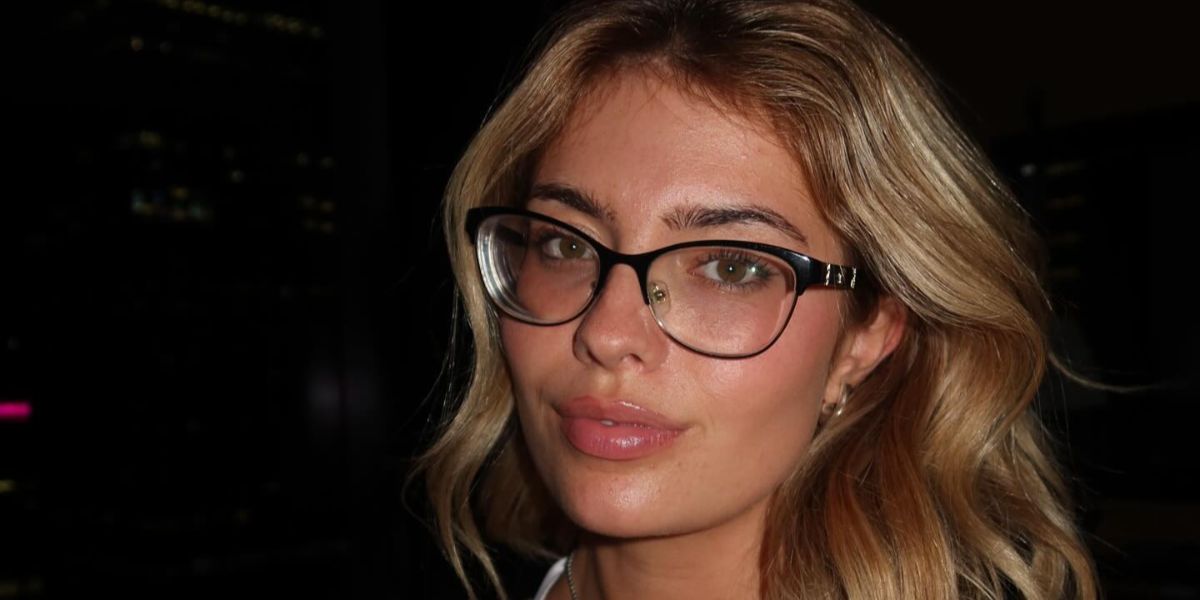 Basketball player Hannah White was seen wearing black Versace 1233Q 1366 cat eye optical glasses in her Thread post, October 2024.