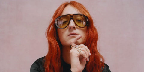 Fashion designer Harris Reed was seen wearing striped brown Tom Ford Bronson TF1044 56E sunglasses with yellow lenses in an Elle Magazine feature.