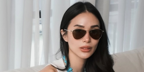 Heart Evangelista was seen wearing gold Saint Laurent Sun SL 831 Vesper 005 sunglasses with brown lenses in her Instagram post, May 2026
