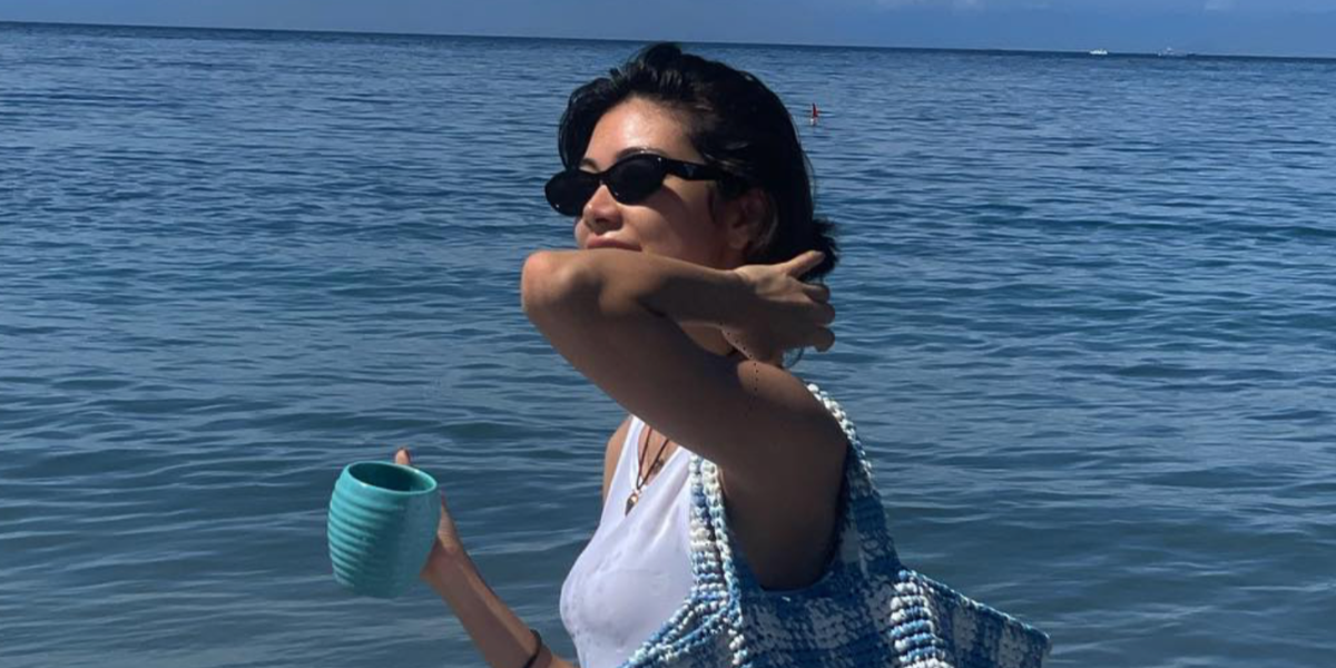 Japanese model and television personality Hikari Mori was seen wearing black Prada PR 26ZS 16K08Z cat eye sunglasses in her Instagram post, July 2023.