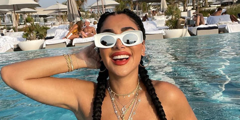 Huda Kattan wears Loewe x Paula's Ibiza LW40033I 21C sunglasses in her Instagram post