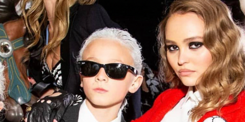 Child's model Hudson Kroenig, pictured with Lily-Rose Depp, was seen wearing black Ray-Ban Kids New Wayfarer RJ 9052S 100/71 Childs Frame sunglasses at the Chanel Spring/Summer 2019 fashion show during Paris Fashion Week. Shop online now on Pretavoir