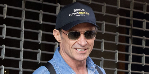 Hugh Jackman was seen wearing gold Oliver Peoples Victory II OV1373S 5035BH sunglasses with green gradient lenses in New York City, April 2026.